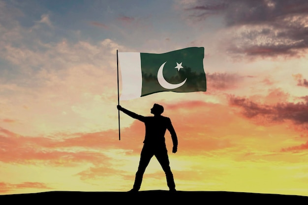 Silhouette maschile che sventola la bandiera del Pakistan 3D Rendering