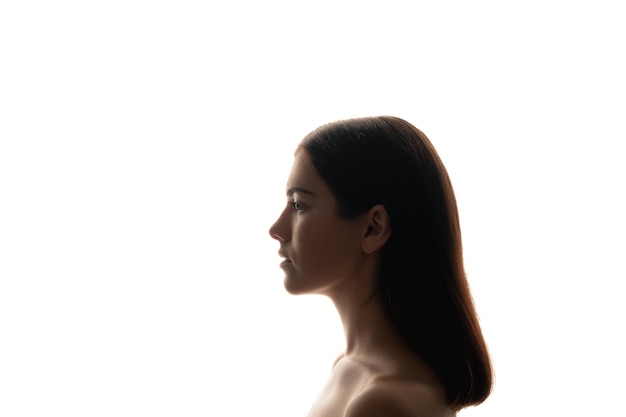 Silhouette ritratto di profilo Bellezza naturale Donna isolata on white Perfezione di cura della pelle Concetto inconscio