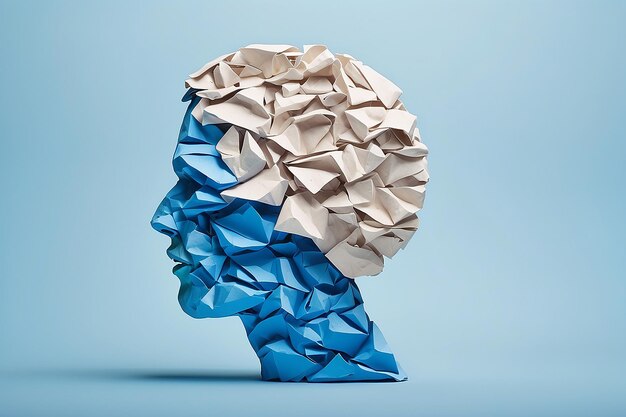 Simbolo di disturbo cerebrale presentato da una testa umana fatta di carta arrugginita strappata sullo spazio di copia blu
