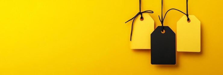 Sleek wide yellow background showcasing yellow and black tags for Black Friday enhances ad visuals