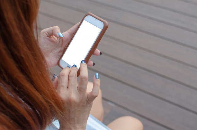 Smartphone della mano della donna