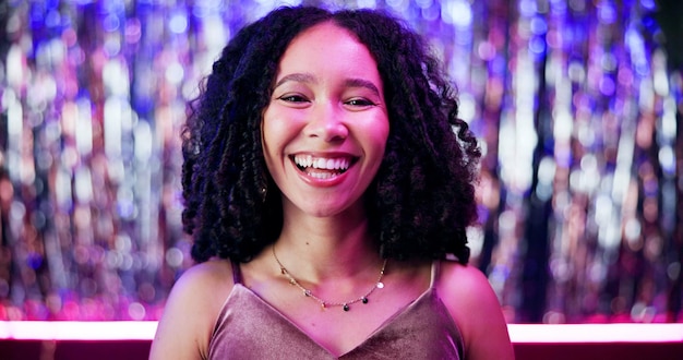 Smile nightclub and portrait of woman at party with neon lighting for celebration or fun event Happy confident and face of female person from Mexico at rave disco or dj gig for entertainment