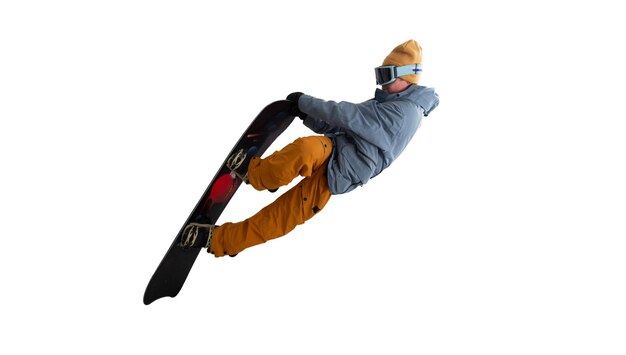 Snowboarder in azione isolato su bianco
