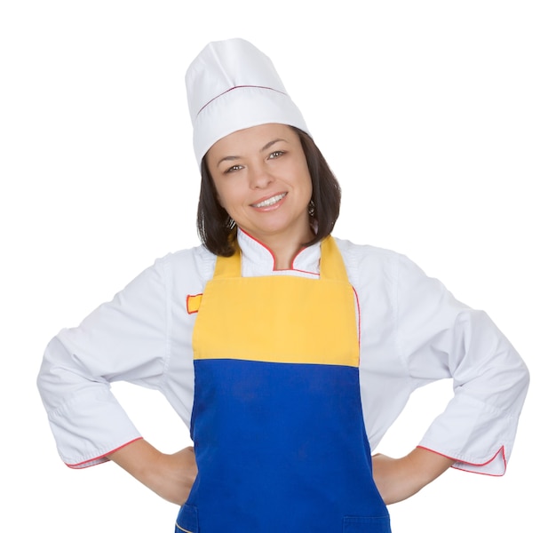 Sorridente bella giovane donna chef in uniforme da cucina su sfondo bianco