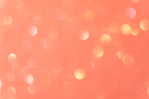Sovrapposizione di luce bokeh Cerchi luminosi Scintille festive Filtro effetto flash Macchie rotonde rosa pastello sfocate su sfondo astratto arancione pesca