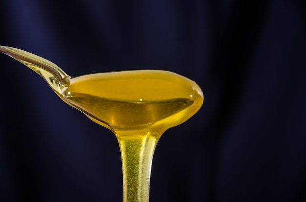 Spoon of honey close-up.