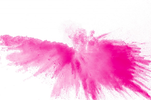 Spruzzi di particelle di polvere rosa. Esplosione di polvere rosa