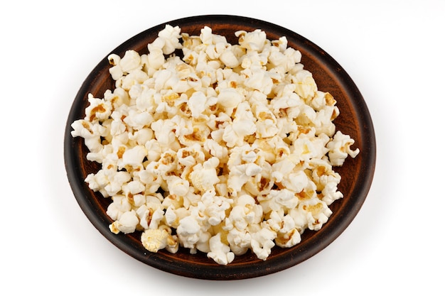 Spuntino delizioso del mais del popcorn in un primo piano del piatto