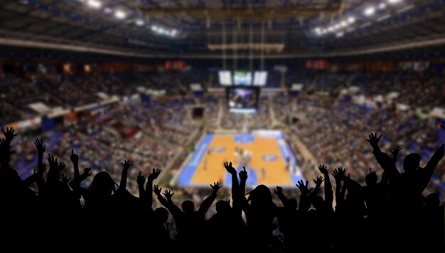 Stadio di basket sfocato con celebrazione pubblica