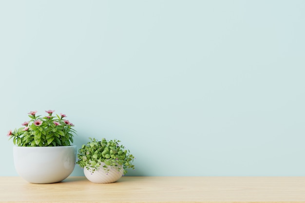 Stanza vuota moderna con le piante sul pavimento di legno, parete blu.