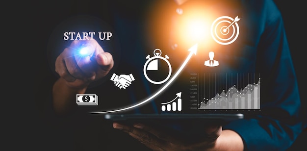 startup concept with icon business and network connection on modern virtual interface from digital tablet people hand touching on tablet developing and improving organization with modern technology