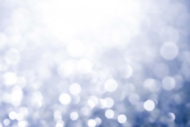 Stelle brillanti della luce dell'estratto di struttura del bokeh di Natale su bokeh. luci vintage glitterate