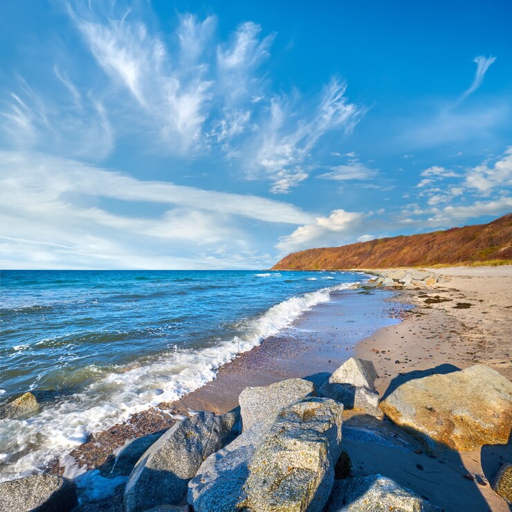 Stones protecting sand on beach. Beach near Kloster village on island Hiddensee