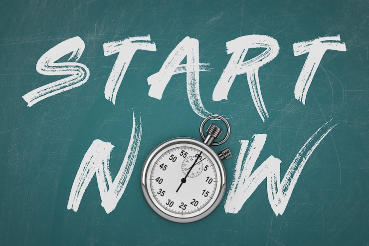Photo stopwatch with start now sign on a chalkboard background. 3d rendering