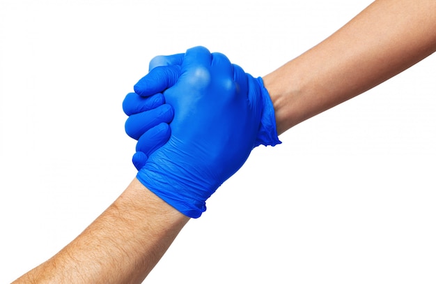 Stretta di mano in guanti blu, concetto di aiuto.