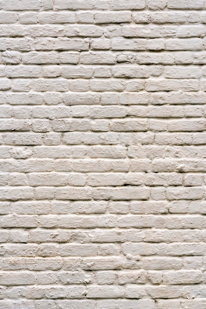 Struttura bianca del fondo del muro di mattoni