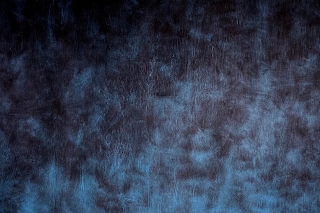 Struttura blu di lerciume. sfondo scuro della parete. Vuoto per il design.