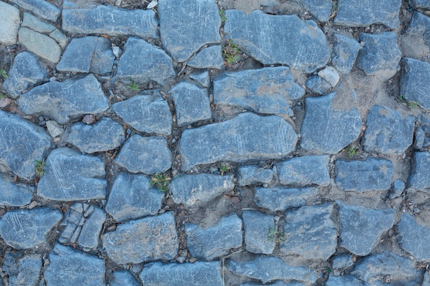 Struttura blu e grigia del muro di pietra. Vecchio sfondo vintage ponte