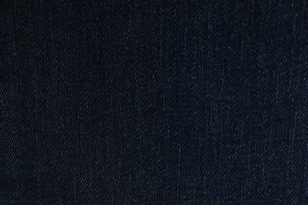 Struttura dei jeans blu scuro come primo piano del fondo