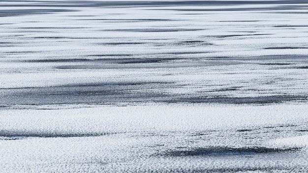 Struttura del ghiaccio innevata, fondo astratto di inverno