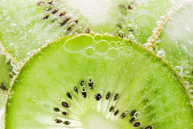 Struttura del kiwi della frutta del fondo con il primo piano delle bolle