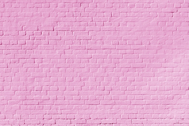 Struttura del muro di mattoni rosa. Costruzione di sfondo architettonico.