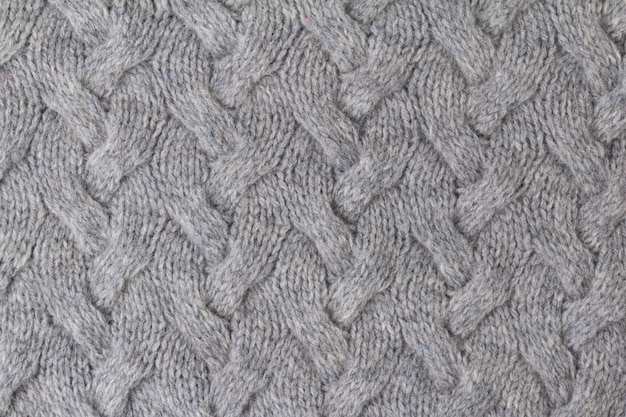 Struttura della fine grigia del tessuto tricottato su. Maglieria di lana.