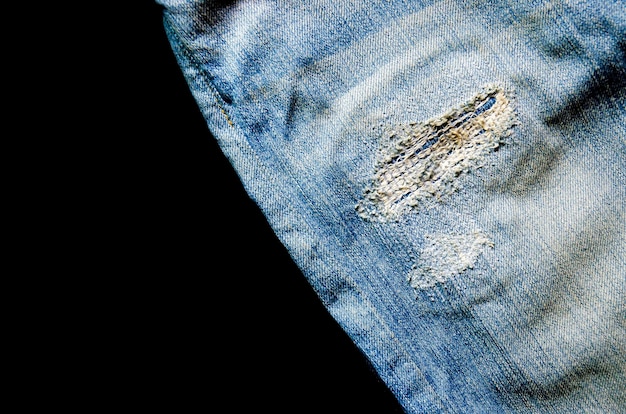 Struttura della mancanza dei jeans e delle blue jeans sul pavimento di legno