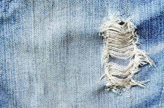 Struttura della mancanza dei jeans e delle blue jeans sul pavimento di legno