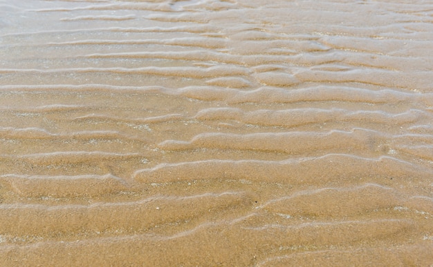 Struttura della natura di sabbia. L&#39;onda di sabbia trama vicino alla spiaggia.