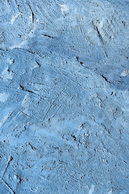 Struttura della parete blu rivestita di cemento.