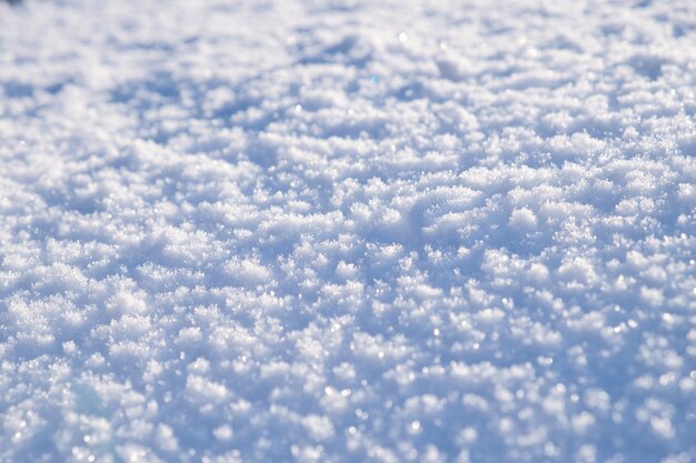 Struttura della superficie della neve in tonalità azzurro Sfondo della stagione invernale