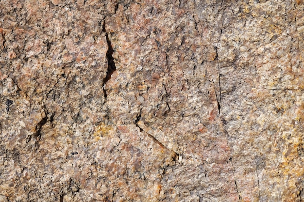 Struttura della superficie della pietra di granito. Consistenza del fondo di superficie di pietra di granito ruvido. Sfondo astratto da materiale naturale