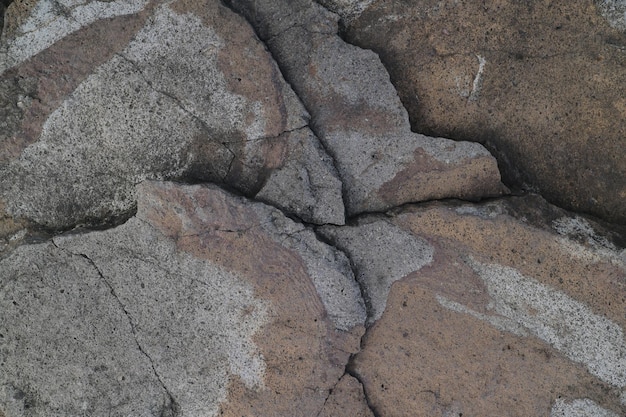 Struttura della superficie della roccia di pietra Struttura ruvida del materiale lapideo Struttura del grunge della roccia di pietra