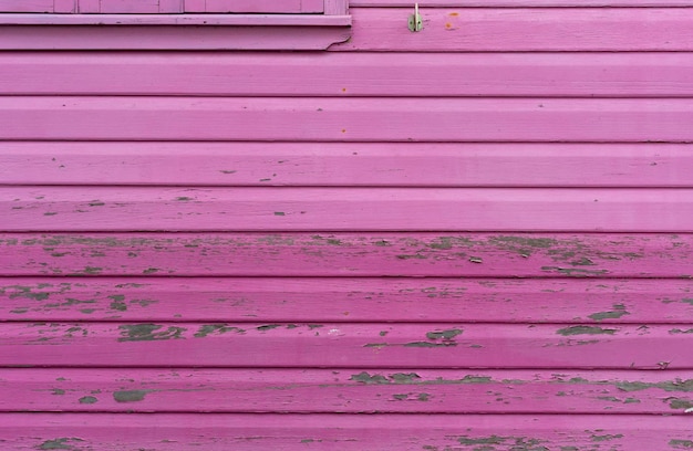 Struttura di fondo in legno rustico invecchiato in rosa.
