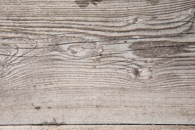 Struttura di legno grigio con crepe