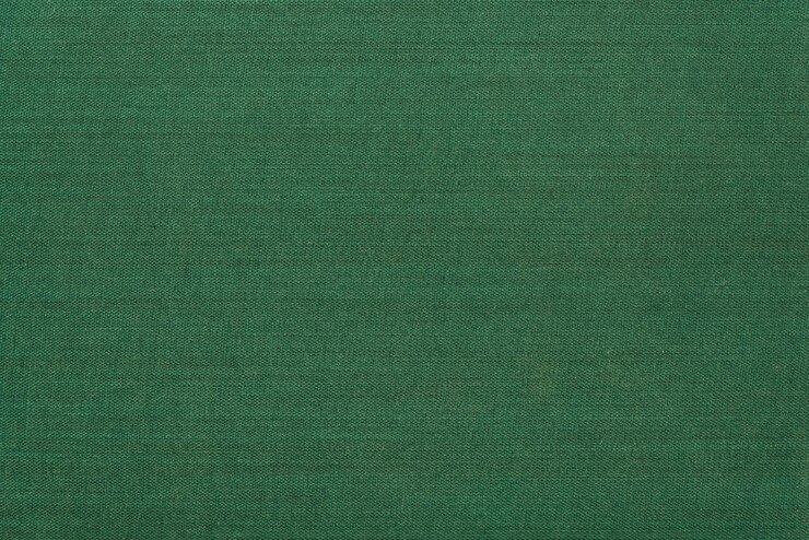 Struttura di vimini astratta di colore smeraldo per lo sfondo. Vista macrofotografica di dettaglio ravvicinata del materiale decorativo della trama, disegno di sfondo del motivo per poster, brochure, catalogo o libro di copertina.