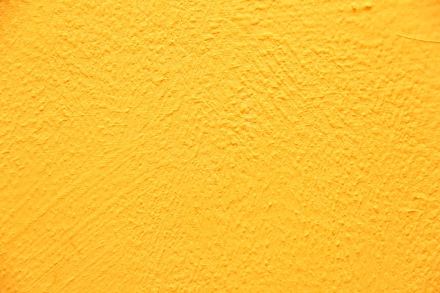 Struttura gialla della parete. Fondo giallo caldo luminoso della parete.