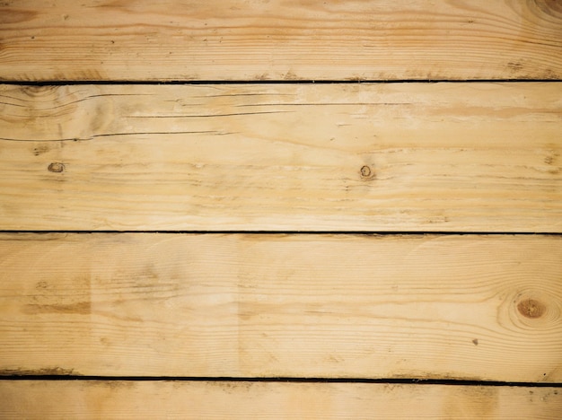 Struttura in legno marrone. Sfondo astratto. fondo rustico fatto di vecchie tavole di legno con fori.