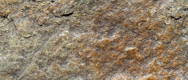 Struttura incrinata della pietra del granito. Superficie di roccia granitica. Contesto in pietra naturale. Copia spazio