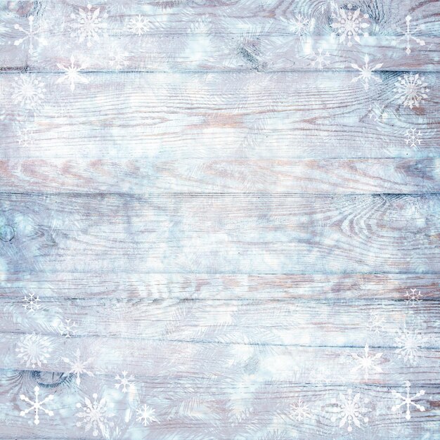 Struttura invernale in legno vintage a luce bianca con fiocchi di neve e pino blu per carta e design scrapbooking