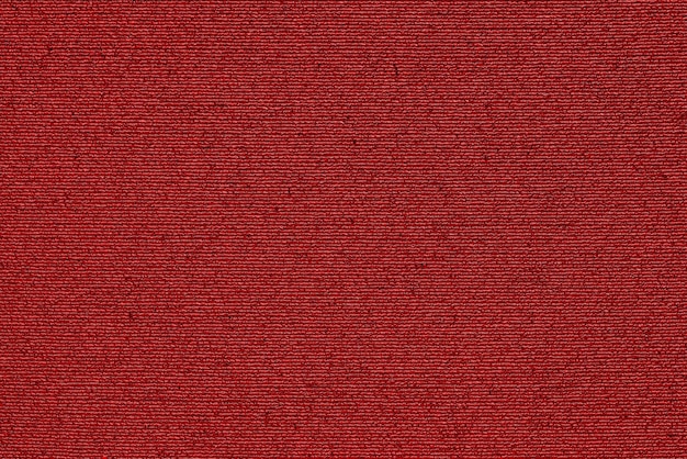 Struttura macro astratta di tessuto sintetico umido per uno sfondo di colore rosso