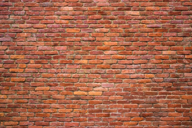 Struttura rossa del muro di mattoni dei blocchi di pietra