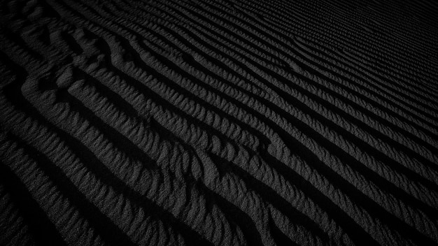 Struttura scura in bianco e nero delle dune di sabbia del deserto