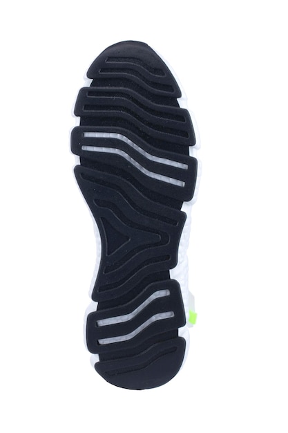 Suola in gomma nera della sneaker con inserti bianchi isolati