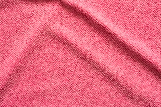 Superficie del panno rosa del microfiber, macro fondo del modello del tessuto