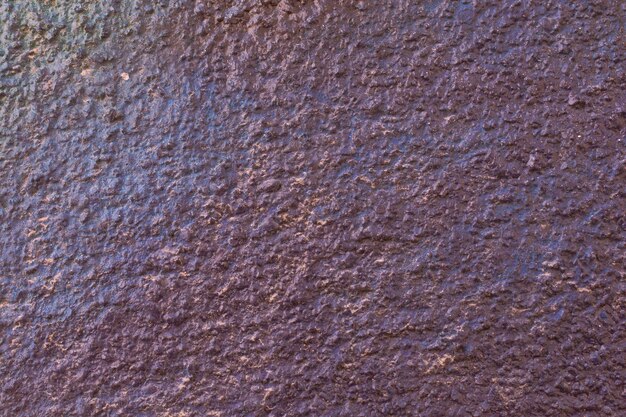 Superficie della parete dipinta di vari colori come texture di sfondo astratto