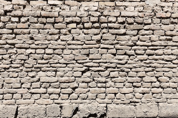 Superficie irregolare di un muro di mattoni Bukhara Uzbekistan