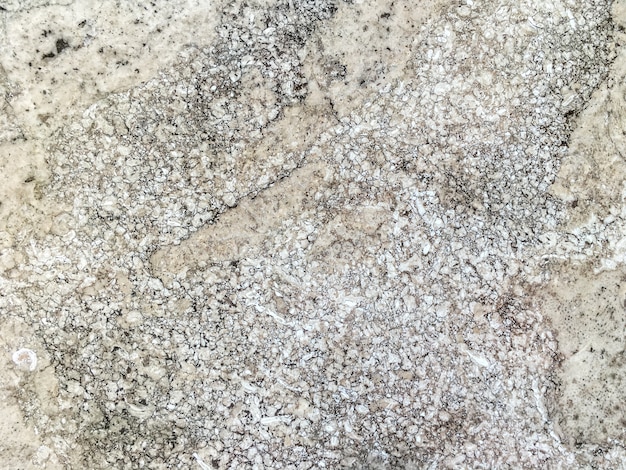 Superficie liscia della vecchia pietra beige di marmo. Texture minerale