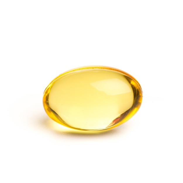 Supplementi a base di olio di colore dorato in capsule di gel morbido concetto di prodotto sano